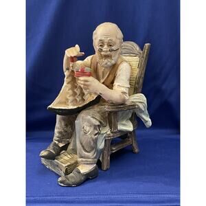 Norleans Old Man In Chair Holding Toy Boat Figurine
